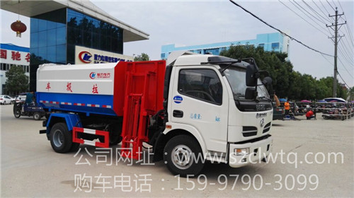國四東風(fēng)3300軸距側(cè)裝掛桶式垃圾車圖片